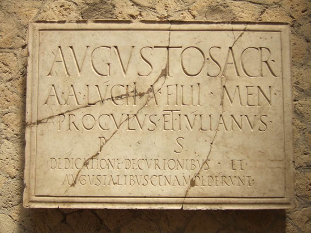 VI.21, Herculaneum. May 2006. Plaque on north wall.
Deiss wrote that the identification of the Augustales’ structure in Herculaneum is made precise by the dedicatory inscription on the wall.
The inscription fortunately was overlooked by the tunnellers, who stripped all the statuary (probably including Proculus and Julian) and the floors from this hall.
See Deiss, J.J. 1968. Herculaneum: a city returns to the sun. UK, The History Book Club, (p.154)
The inscription reads
AVGVSTO SACR
A A LUCII A FILII MEN
PROCVLVS ET IVLIANVS
P S
DEDICATIONE DECVRIONIBVS ET
AVGVSTALIBVS CENAM DEDERVNT.
According to Wallace-Hadrill this translates as –
“Sacred to Augustus. Aulus and Aulus Lucius, sons of Aulus, of the tribe Menenia, called Proculus and Julianus, at their own expense, to mark the dedication gave a dinner to the decuriones and the augustales.”
The plaque was found in 1961, according to the archival photograph on page 180.
See Wallace-Hadrill, A. (2011). Herculaneum, Past and Future. London, Frances Lincoln Ltd., (p.180)